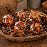 Fall fillable ornament decorations featuring autumn leaves and raffia ribbon for seasonal home d�cor and Thanksgiving decorating.