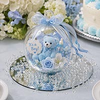 Baby shower fillable ornament centerpiece idea featuring blue flowers and teddy bear decorations for baby shower and nursery d�cor.