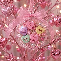 Decorative Valentine's fillable ornament idea with flowers and romantic embellishments displayed on an ornament stand for holiday d�cor.