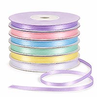 Stack of narrow satin ribbon spools in soft pastel colors with a loose length of lavender ribbon on a white background, ideal for doll making, gift wrapping, sewing, embroidery, jewelry, and decorative craft projects.
